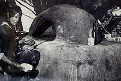 Nubian woman baking bread